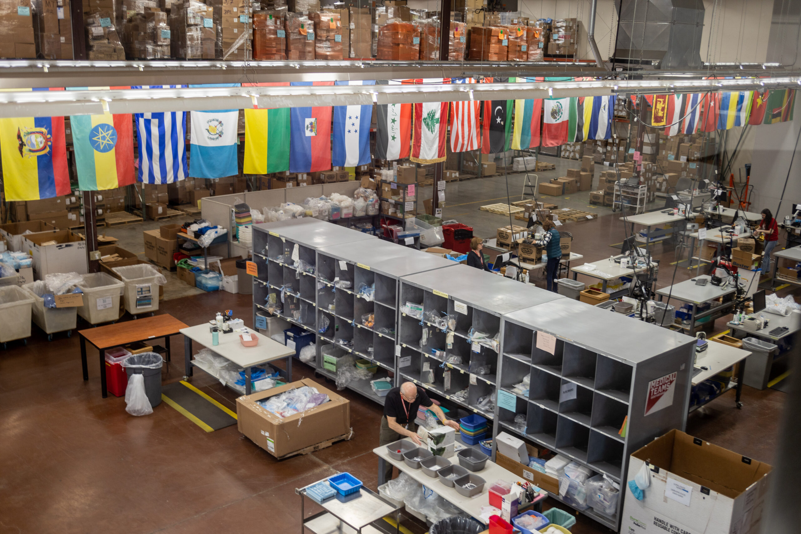Volunteers packing medical supplies in our Distribution Center at the Tigard Headquarters.  