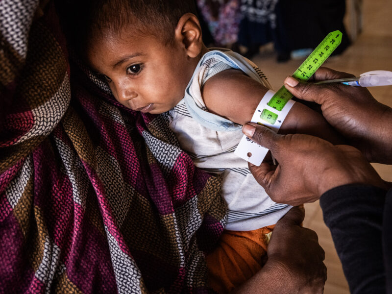 A child has his MUAC measurement taken at a clinic in Khartoum.
