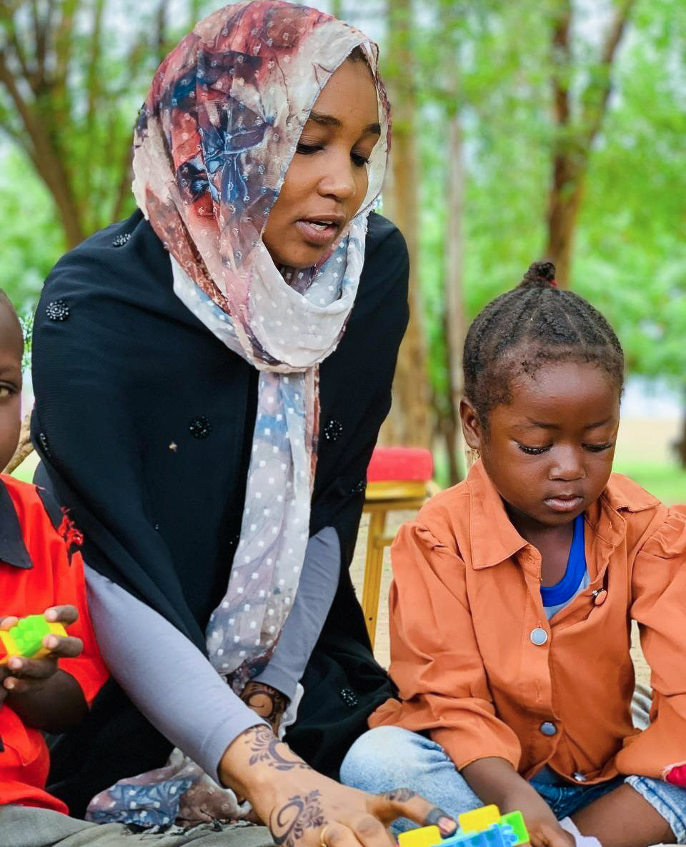 Asma, a clinical psychologist with Medical Teams facilitates a play therapy session with local children in Al Jazirah, Sudan. Our Mental Health and Psychosocial Support teams were able to provide mental health support to over 191,000 people in Sudan this past year. 