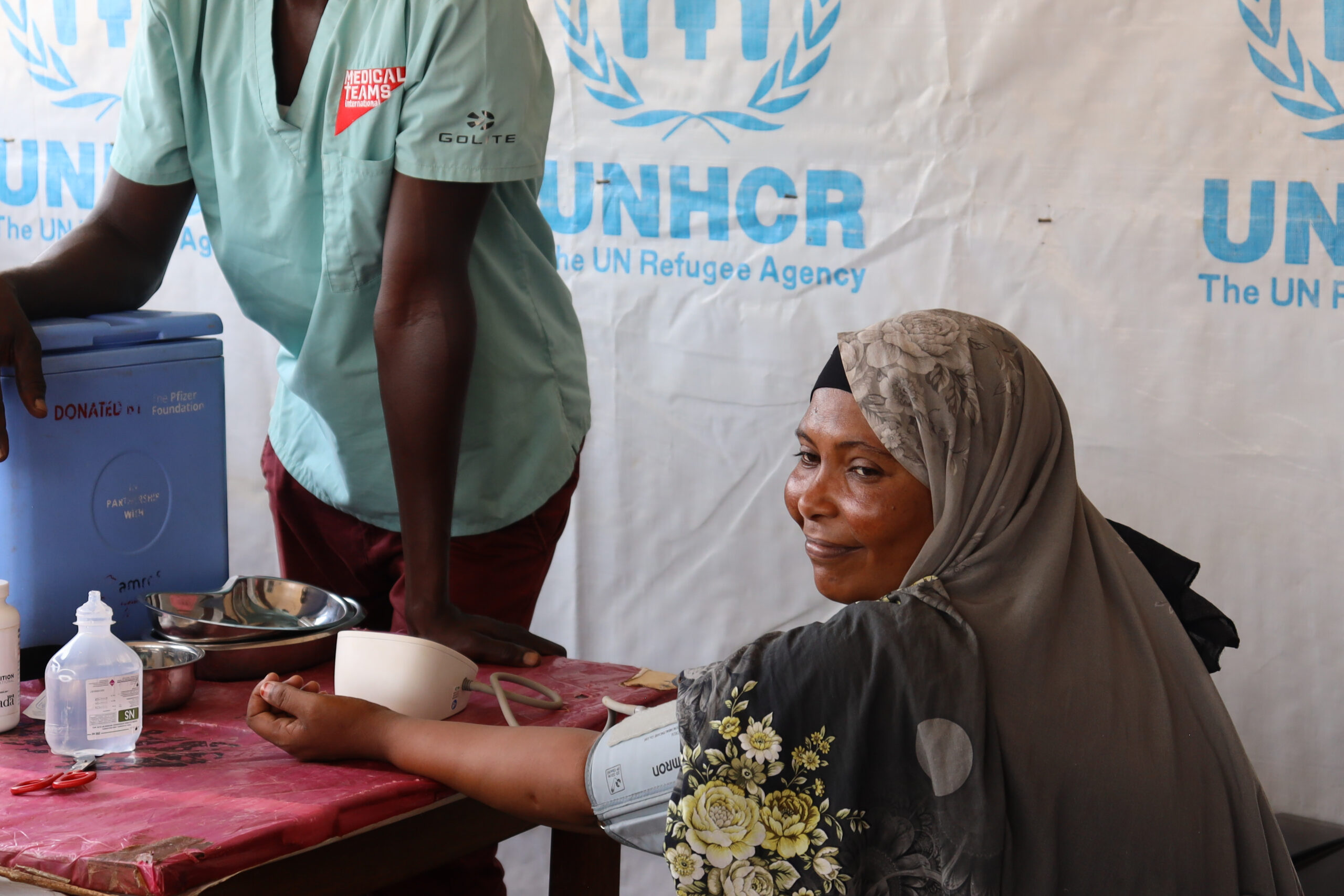 A Sudanese woman is screened after crossing the border into Uganda. Kevine and her family would have received medical attention at a border clinic like this one.