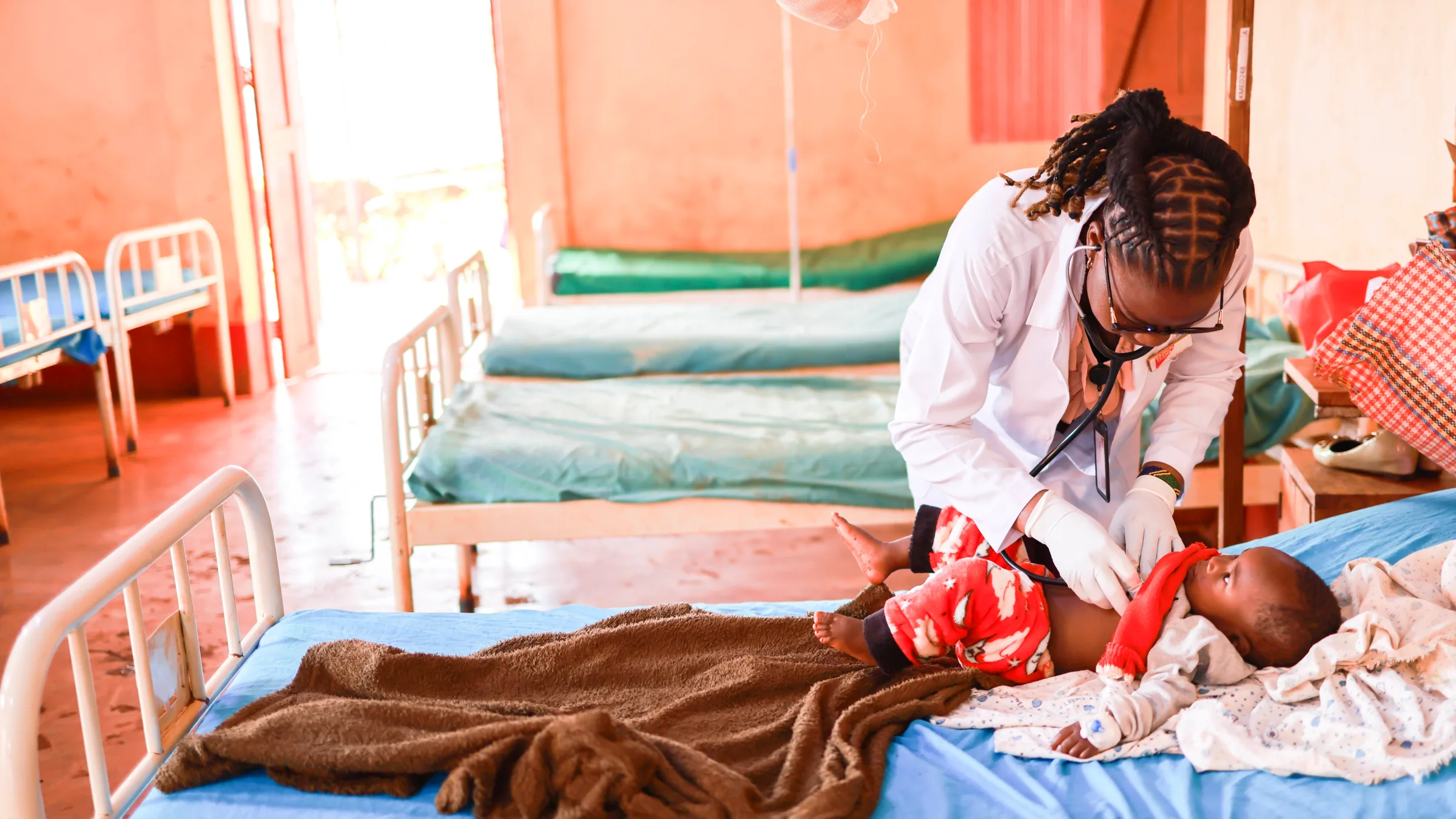 Dr. Jane Gervas with patient at clinic in Tanzania