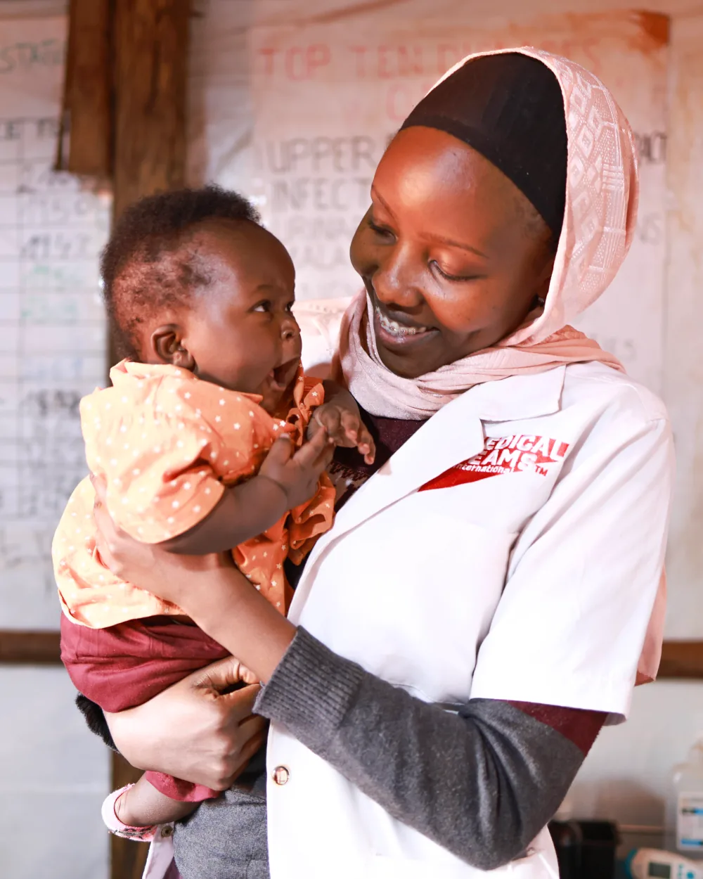 Dr. Rehema with baby she is taking care of in Tanzania