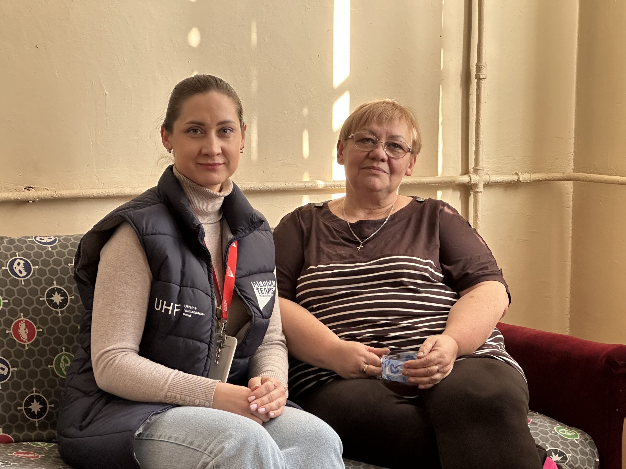 Oksana and one of our Mental Health and Psychosocial Support Officers sharing a cup of tea and a safe space to talk about the impacts of war. 