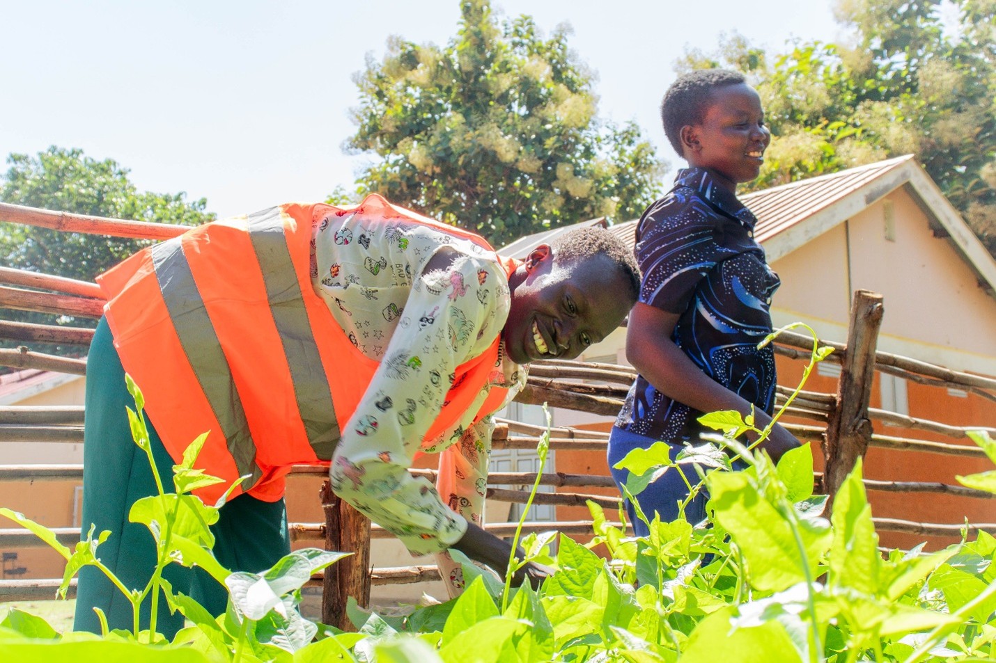 Mothers tend to the vegetables in the Community Kitchen Garden