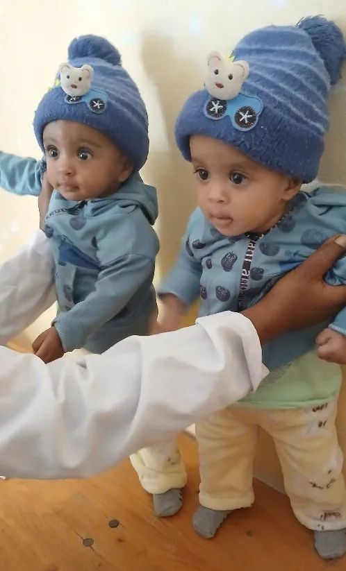 Meresa's twins in Ethiopia after being treated for malnutrition.